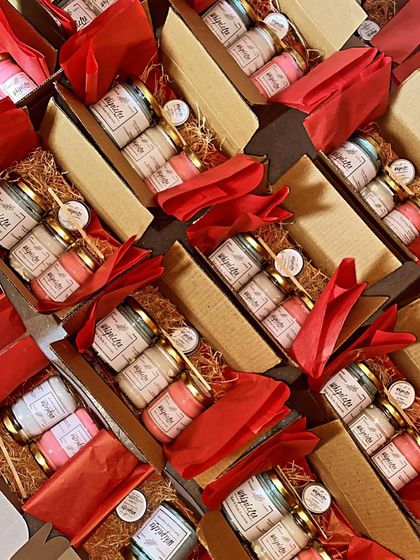 This is what a bulk order of custom gift boxes looks like before shipping. Each box contains a curated selection of our handmade products, packed with care and ready to delight employees or clients.