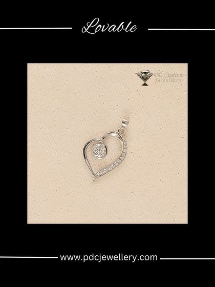 A lovable heart-shaped pendant crafted in white gold and diamonds. The design features a swirling line of diamonds leading to a central solitaire, creating a modern and romantic look.