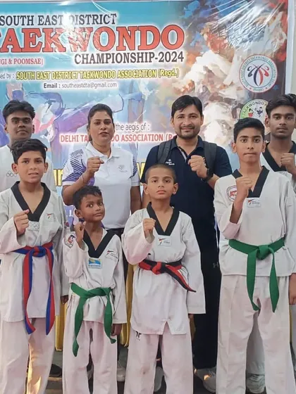 Our team at the 11th South East District Taekwondo Championship. We stand together as a team, supporting each other.