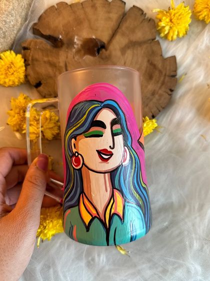 This vibrant beer mug features a smiling woman with colorful hair, ready for a fun evening.