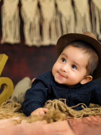 A curious little explorer at his half-birthday shoot. His sweet, upward glance is absolutely heart-melting.