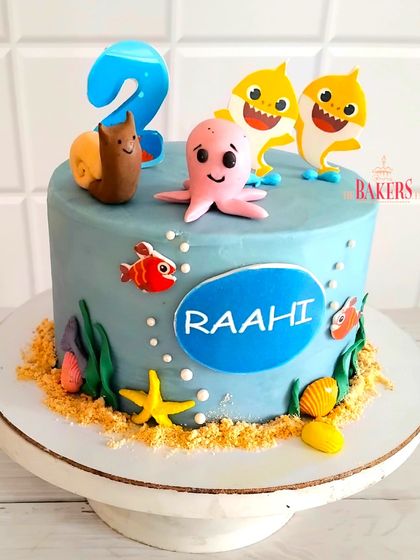 A cute Baby Shark cake for Raahi's 2nd birthday. This underwater-themed cake features Baby Shark, an octopus, and other sea creatures. The flavor was a delicious vanilla with strawberry and cream cheese.