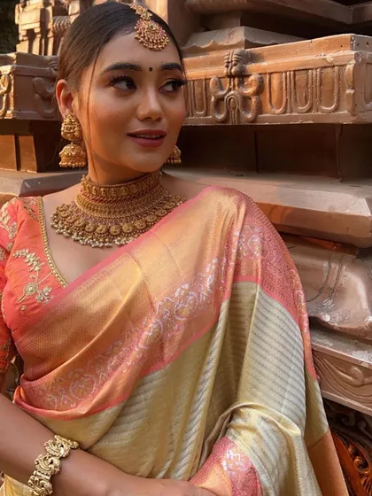 A close-up of a model wearing our antique gold finish choker and jhumkas, a versatile set for any festive event.