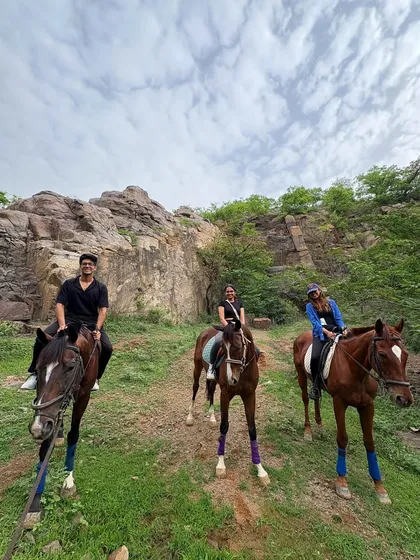 A group of friends enjoying their ride together against the backdrop of the rocky Aravali terrain. Our safaris are a great way to bond and share a unique outdoor adventure.