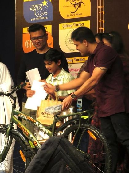 It's not just about singing, it's about the entire experience. Here, a young winner receives his prize, a brand new cycle, at the 'Singathon' finale.