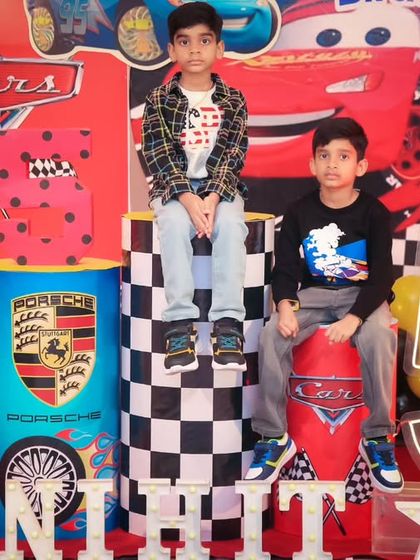 A thrilling 'PJ Masks' themed birthday party, with character cutouts, a cityscape backdrop, and blue and green balloons, ready for a night of adventure.