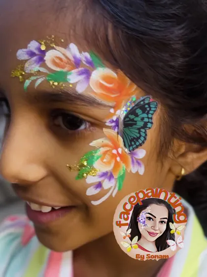 Bright and cheerful with orange and purple flowers surrounding a teal butterfly. I love creating these colorful garden-inspired looks.