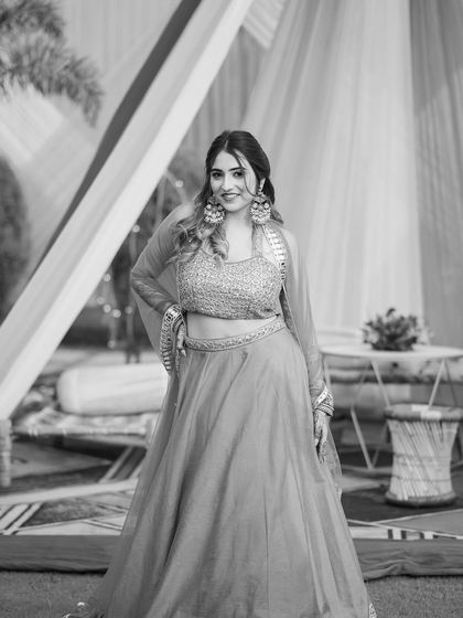 A classic black and white portrait in the lehenga. This adds a touch of timeless elegance to the wedding series.
