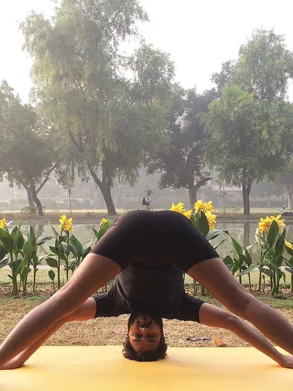 Prasarita Padottanasana (Wide-Legged Forward Bend) is an inversion that stretches the hamstrings, calves, and hips. It brings fresh blood to the brain, leaving you feeling refreshed and calm.