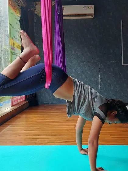 In aerial, we learn to balance the body which quiets the mind. This pose, while looking simple, requires a lot of focus and core strength.