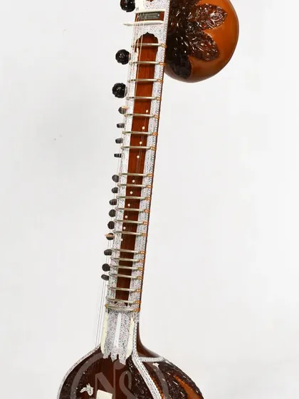 Another angle of the Pandit Ravi Shankar style sitar, emphasizing its height and the elegant curve of the neck.