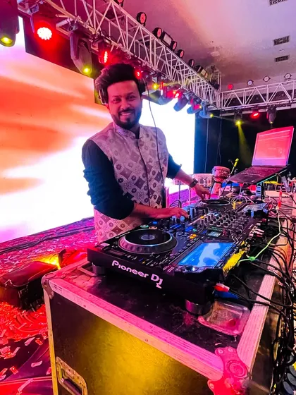 At the console for a Hyderabad wedding, mixing tracks to create an unforgettable night.