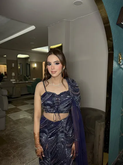 This client was ready for her Roka in a stunning navy blue lehenga. We kept the makeup soft and glowing to let her outfit and natural beauty stand out.
