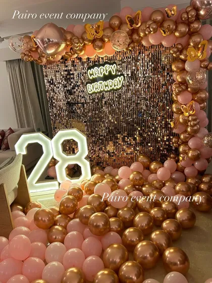 Even a simple room decoration can feel grand and special. For this 28th birthday, I used a rose gold sequin wall, matching balloons, and light-up numbers to create a glamorous and intimate surprise right at home.