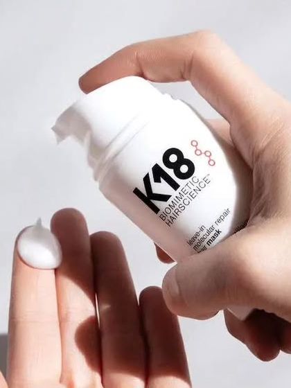 A close-up of the K18 Biomimetic Hairscience leave-in molecular repair hair mask, a transformative treatment we offer to restore damaged hair.