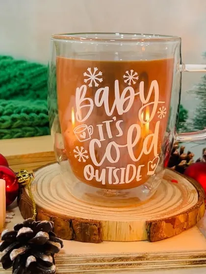 Get cozy with our Christmas themed double-walled glass mug. This one says 'Baby It's Cold Outside'.