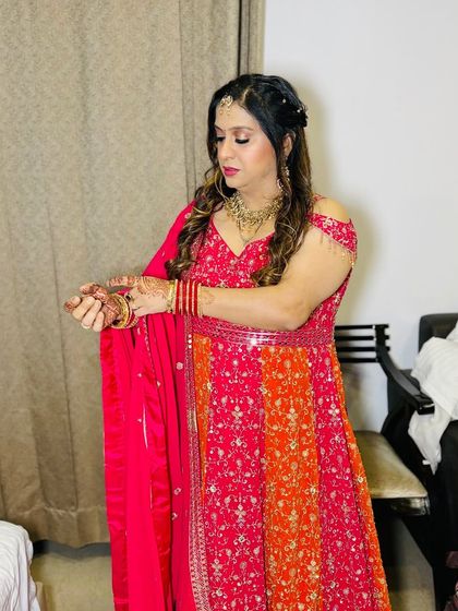 A close-up of the client adjusting her bangles.