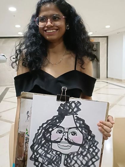 This student's curly hair and glasses made for a great caricature.