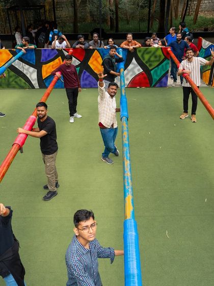 An overhead shot of our life-sized Human Foosball court. Here, you and your colleagues are the players, strapped to the poles.