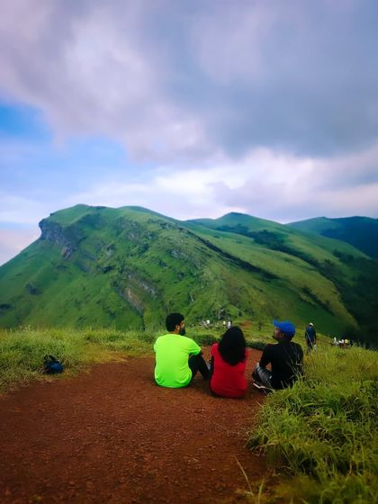 Taking a moment to sit and enjoy the serene landscape of Chikmagalur.