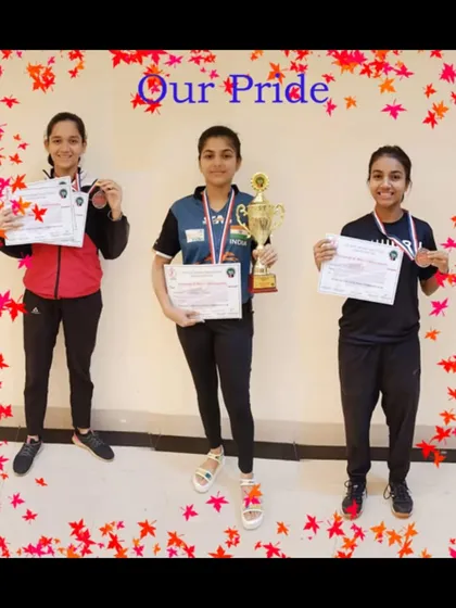 Our pride, the girls' team, showcasing their medals from the TSTTA District Championship. We are committed to developing strong female athletes in the sport.