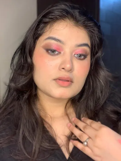 This image shows the soft blending and color combination of the pink and brown eye makeup.