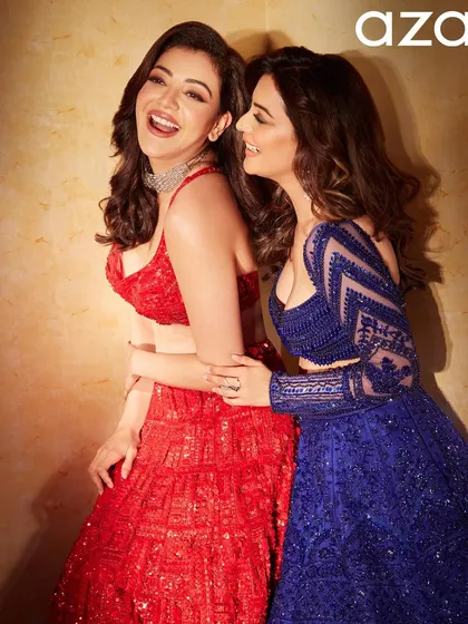 A fun, candid moment between sisters on the Aza Fashions set. Even in laughter, the glamorous waves hold their shape, proving that a good hairstyle is ready for anything.
