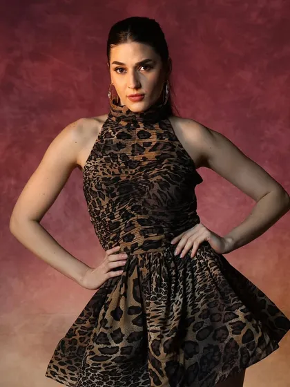 A confident and powerful look for a fashion campaign. The makeup is kept chic and neutral to let the model's expression and the clothing be the main focus.