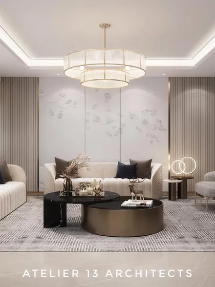 A look into a luxury residence in Suncity, Gurugram, where we designed a formal living area with a light, neutral color scheme. The space is defined by its clean lines, plush seating, and a statement chandelier, creating an atmosphere of understated elegance.