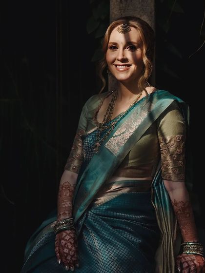 A duplicate of 200, this artistic shot highlights the beautiful contrast of light and shadow on the bride's stained henna.