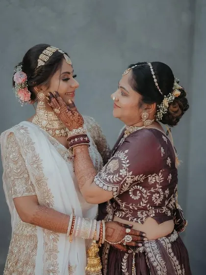 A heartwarming moment between the bride and her mother. Both are looking beautiful with soft, elegant makeup.