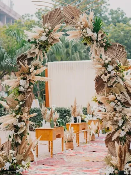 Your love story is unique, and your decor should be too. For this couple, we created a rustic and chic 'Farmer's Market' theme, complete with pampas grass arches and fresh produce, telling their story in every detail.
