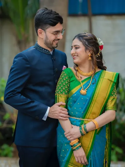 A beautiful three-quarter portrait of Ameya and Gautami, highlighting the details of her saree and his classic bandhgala jacket.