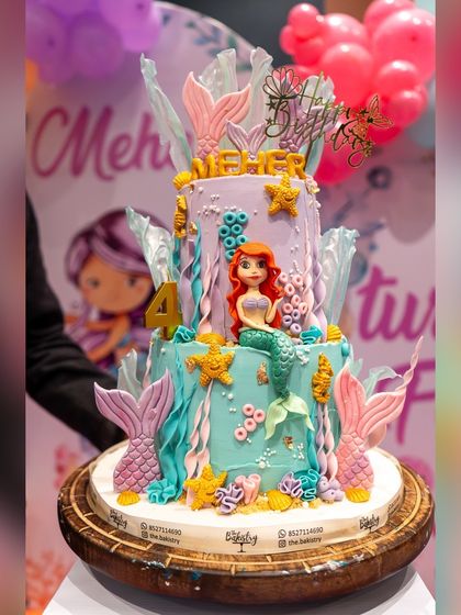 A close-up of the incredible mermaid-themed cake, featuring Ariel and intricate under-the-sea details.
