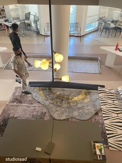 Material sourcing is a crucial part of our creative process. This behind-the-scenes shot shows our team reviewing carpet and rug samples in the studio, ensuring we select high-quality, sustainable, and aesthetically fitting materials for our projects.