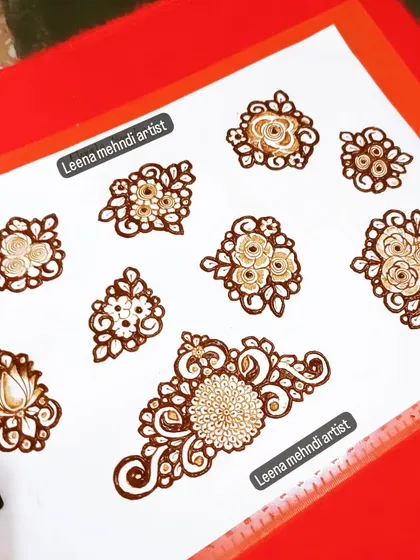 Another collection of floral butis and a central lotus motif. Practicing these small elements ensures my designs are always sharp and beautiful.