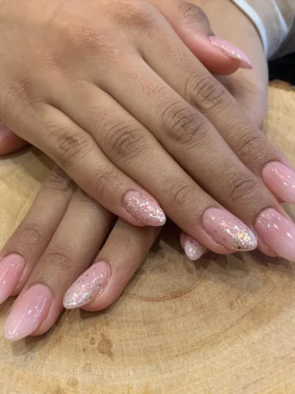Birthday special nails featuring a soft pink base, a sparkling glitter accent nail, and a subtle ombre effect.