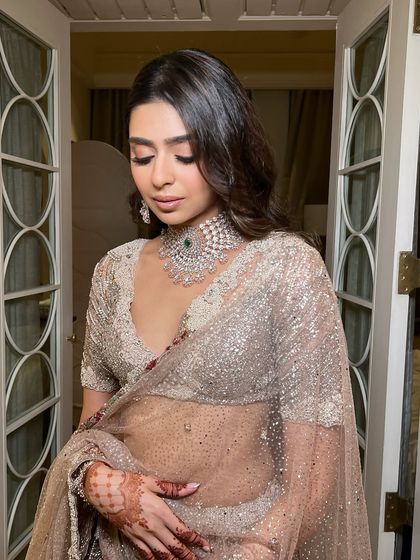 This shot captures the dreamy, romantic quality of the look. With her eyes closed, you can appreciate the soft blend of the eyeshadow and the overall harmony of the makeup.