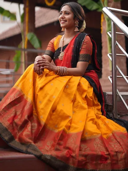 A full-length view of the beautiful traditional South Indian attire.