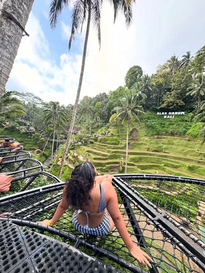 Life is simple. Lounging on a net bed overlooking the rice terraces in Ubud. I’m wearing a gingham bikini, proving that you can bring your favorite prints everywhere.