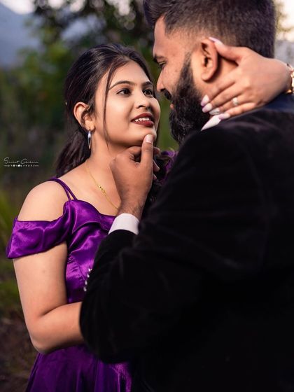A close-up shot full of love and emotion. This pre-wedding photo captures the connection between the couple, with the bride wearing a vibrant purple gown.
