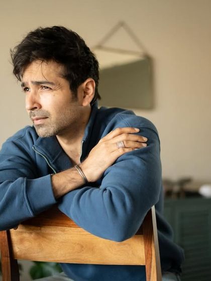 Another angle from the at-home session, this shot captures a thoughtful, off-camera gaze, adding a different mood to the series.