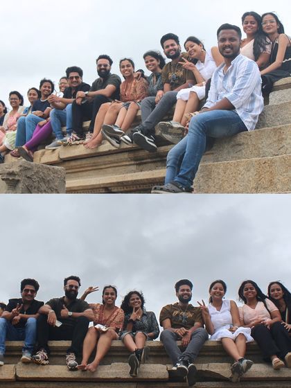 Travelers relaxing on the stone steps of a temple ruin in Hampi, taking in the historical atmosphere.