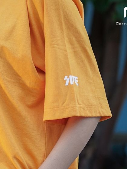 A close-up of the sleeve detail on the Flypside tee, featuring their 'SIDE' logo for an extra touch of branding.