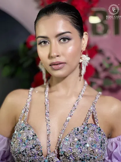A close-up of the lilac bridal look, focusing on the intricate beadwork of the gown and the soft, matte makeup. The look is all about modern elegance and high-fashion glamour.
