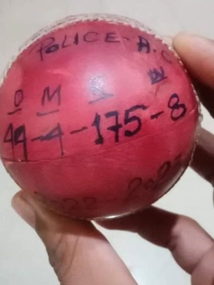 The match ball from Asif Mansoori's incredible spell, marked with his figures: 44 overs, 4 maidens, 175 runs, and 8 wickets. A historic achievement for a player who represented Jamia with distinction.