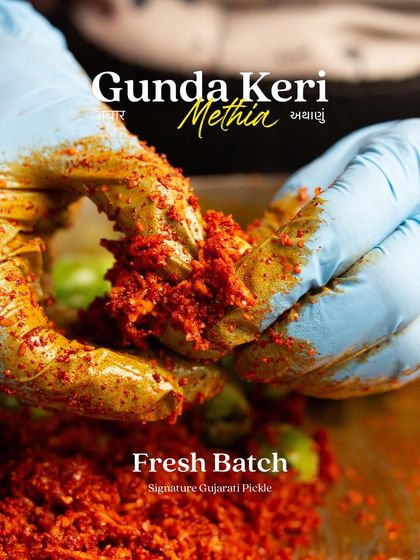 Our team's hands, covered in the rich masala, carefully mix the Gunda Keri pickle. This personal touch ensures the spices are evenly distributed for the perfect flavour in every bite.