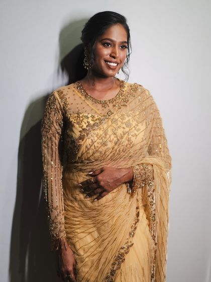 My stunning bride Anukraha, reception-ready in a golden ensemble. Her soft gold smokey eye and nude brown lips create a timeless and sophisticated look.