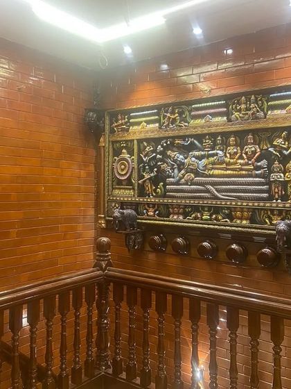 This wide shot shows the Ranganathaswamy panel installed at the top of a staircase, becoming a magnificent focal point for the entire home. We are thrilled to see our work so beautifully displayed.