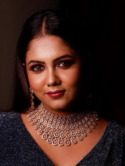 A dramatic and beautiful portrait of our model Purvika. The rose-gold choker stands out beautifully against the dark, shimmering dress.